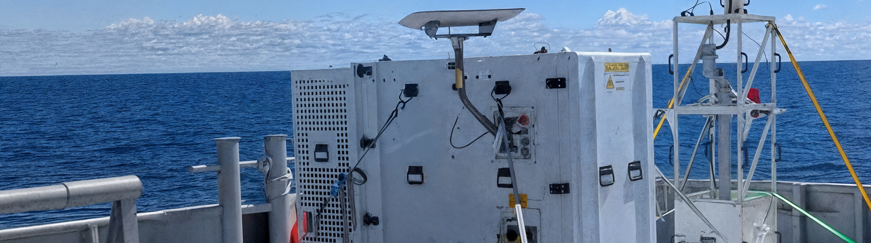 Marine equipment on a vessel deck with ocean views, showcasing advanced technology for maritime capabilities.